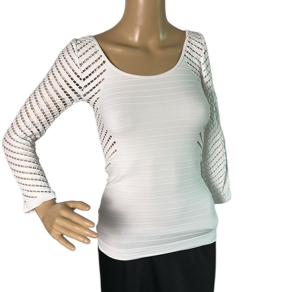 BEBE  fitted white top,S, eyelets,PTP 12” ,stretches to 17”,bodycon, U.S.